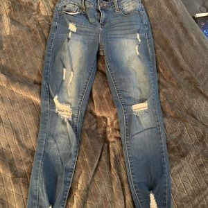 Blue skinny jeans with rips